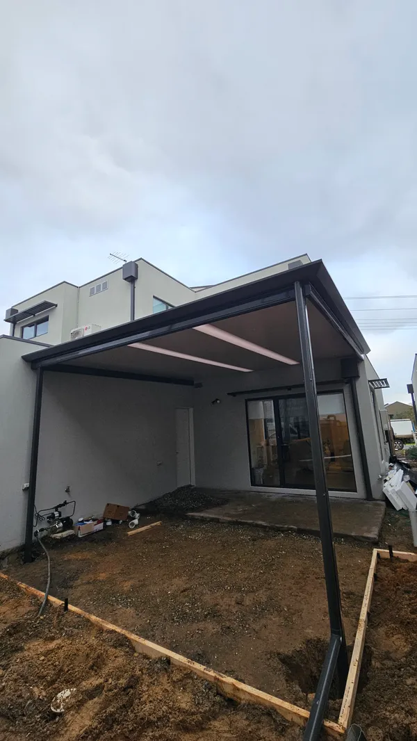 Completed insulated townhouse patio viewed from the garden