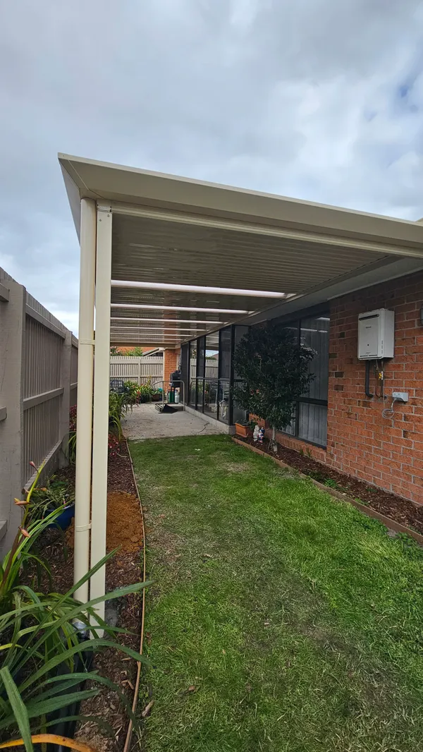 Cream Stratco Outback flat patio along a Wantirna South home