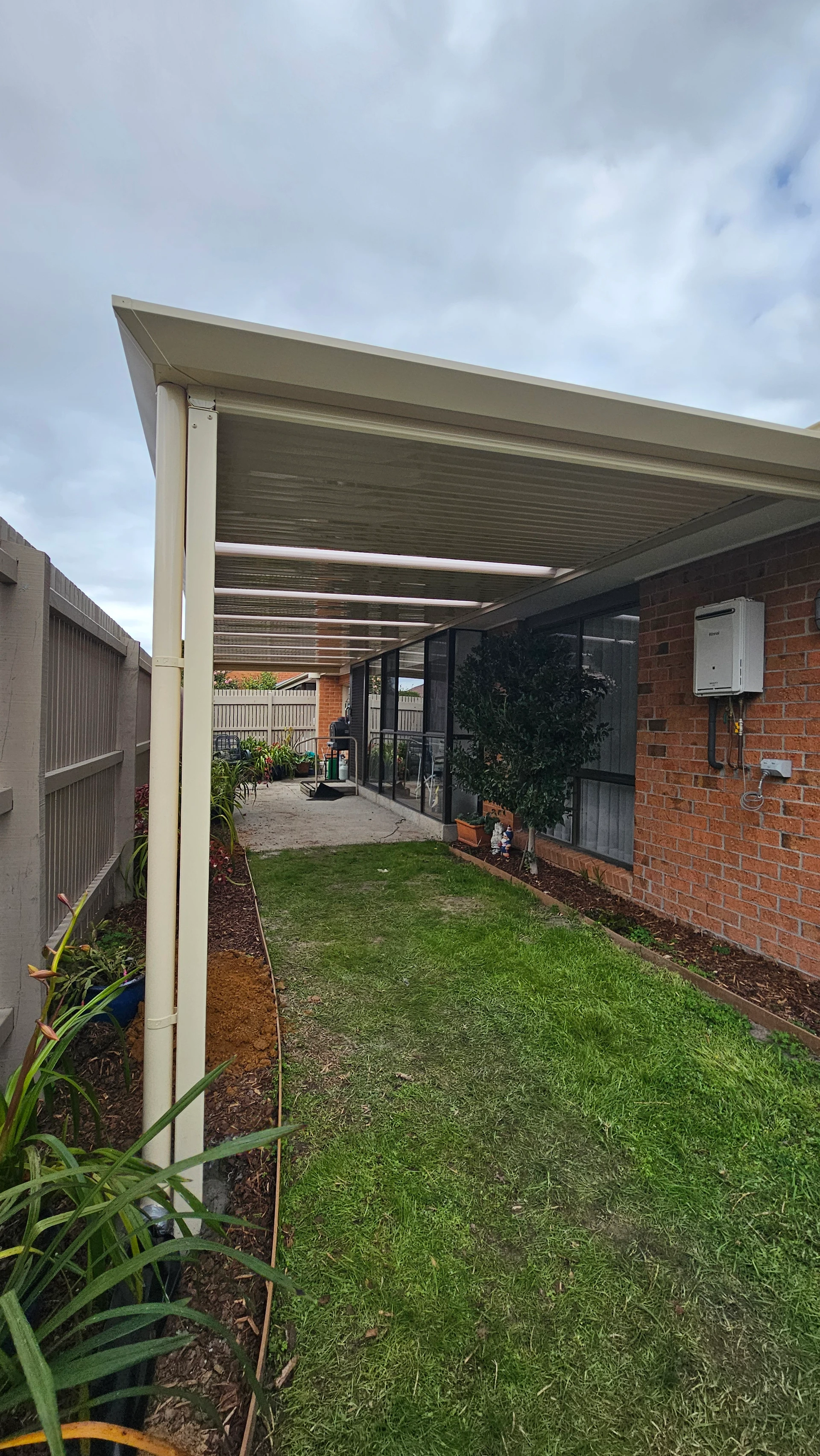 Cream Stratco Outback Flat Patio with Rooflites