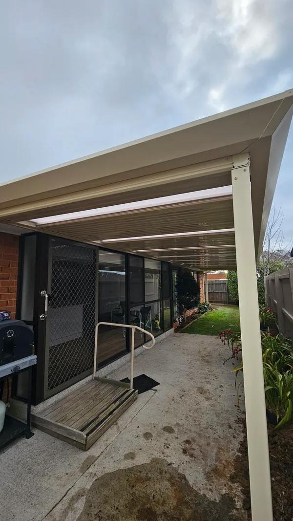 Cream flat patio roof with evenly spaced translucent Rooflite panels