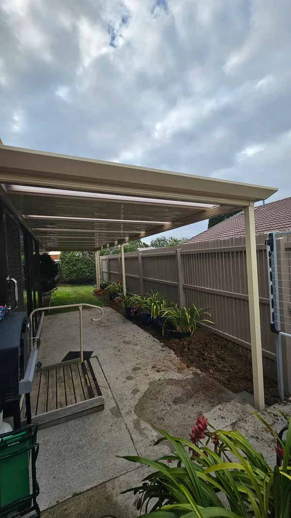 Stratco Outback patio covering a concrete walkway