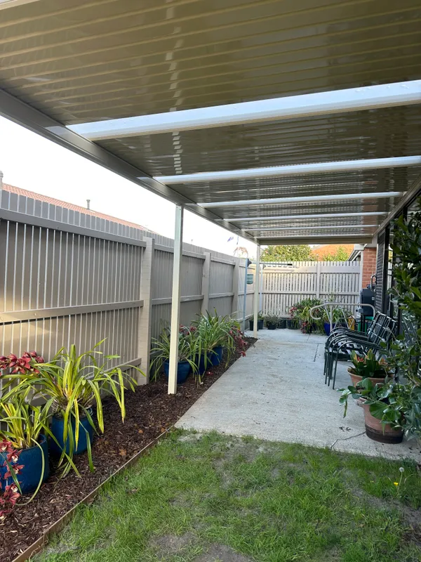 Completed cream patio and landscaped side garden