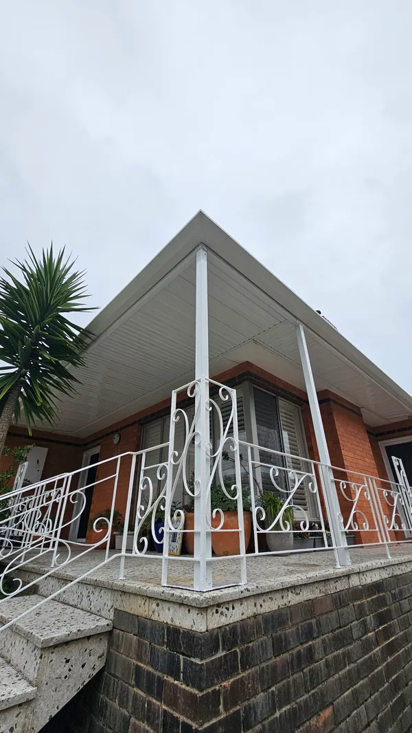 White steel post and flat verandah roof detail