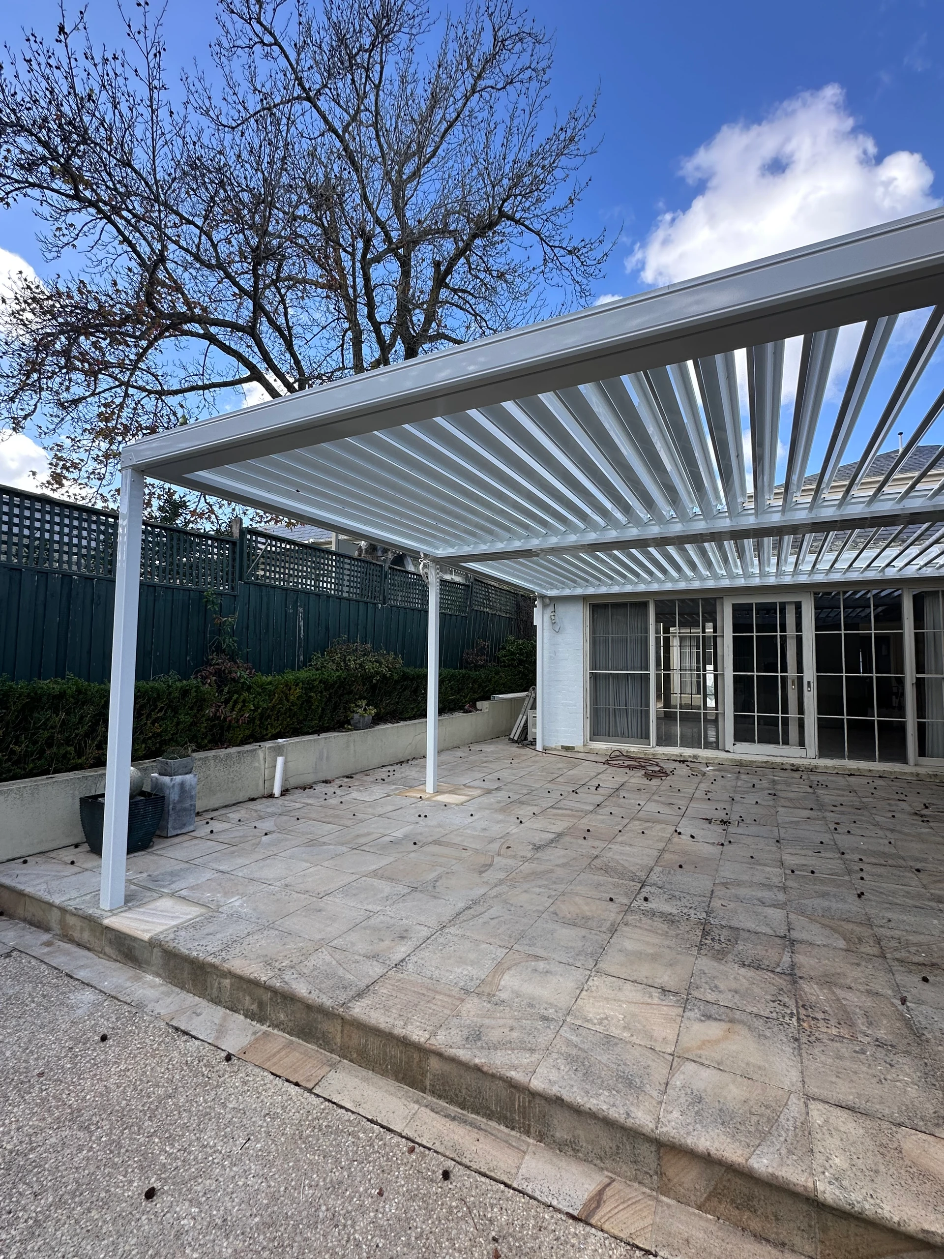 White Stratco Outback Sunroof Courtyard